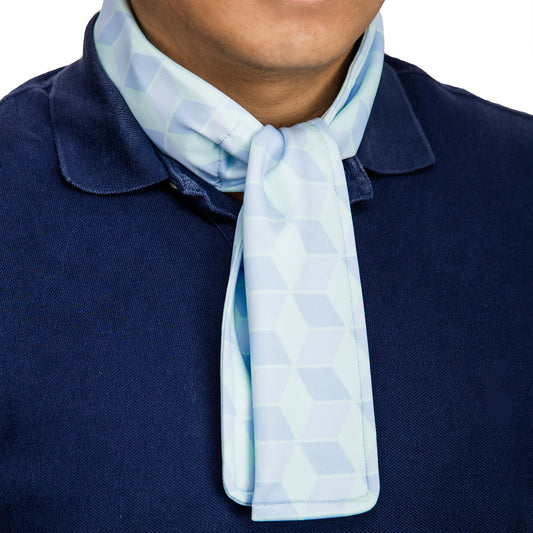 Cooling neck scarf with cubic pattern worn over a polo shirt for hot-weather casual comfort